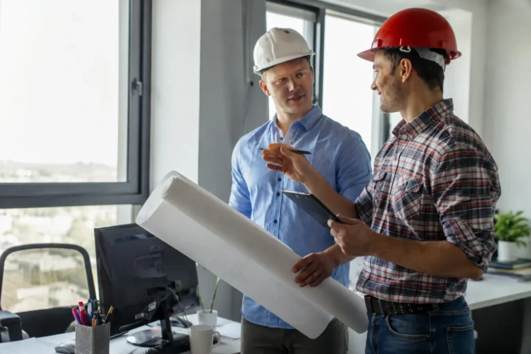 contractors reviewing property plans during a commercial building inspection