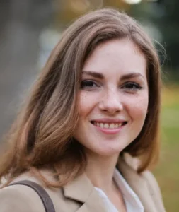 Customer testimonial headshot of a smiling woman with long hair