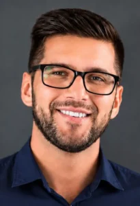Customer testimonial headshot of a smiling man wearing glasses